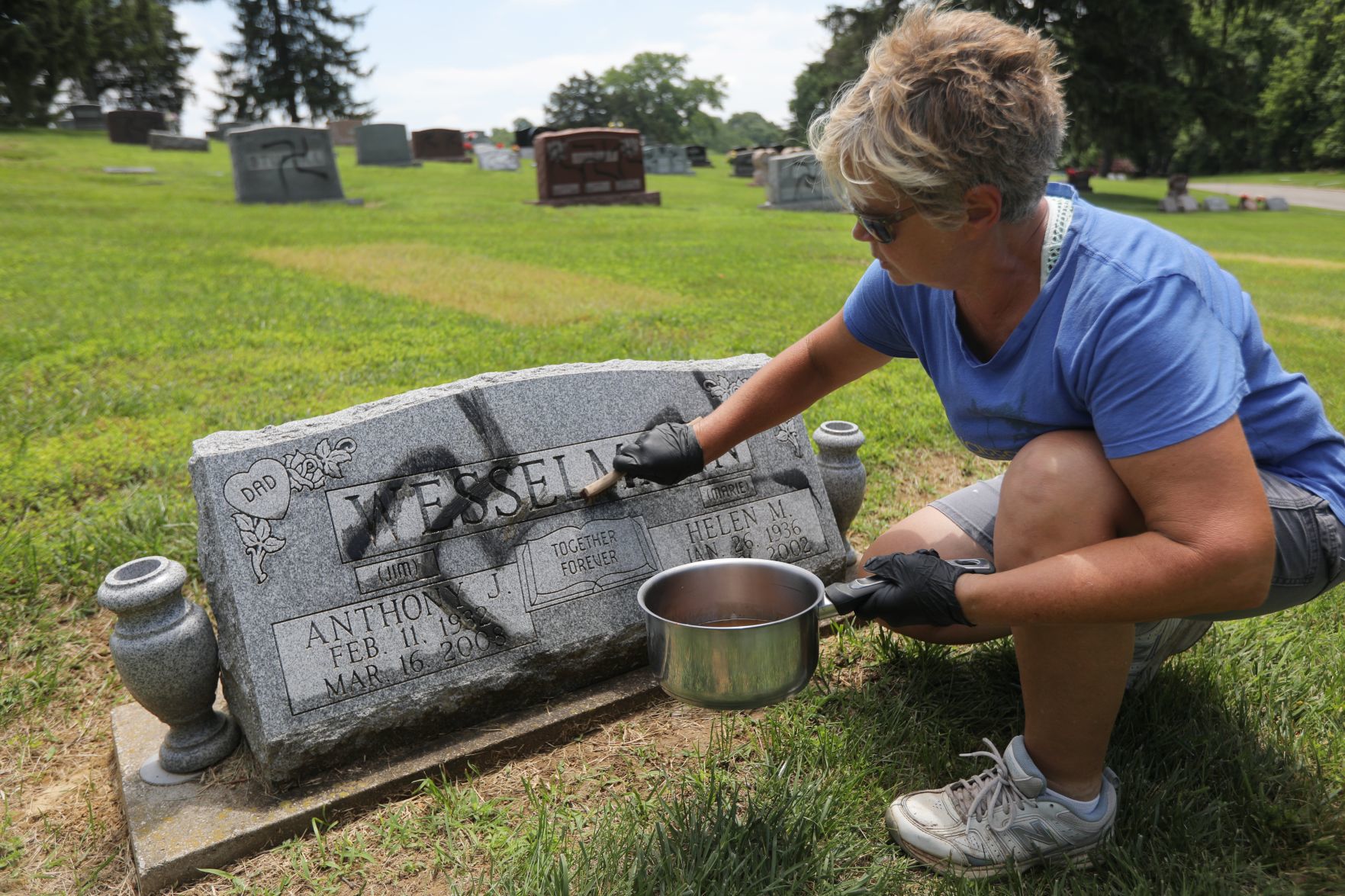 Vandal spray-paints swastikas 150 to 200 headstones and markers